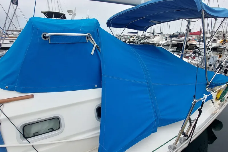Slide: The Image of Blue canvas cover on 2002 Jeanneau Sun Odyssey 43 DS sailboat in marina. - 18
