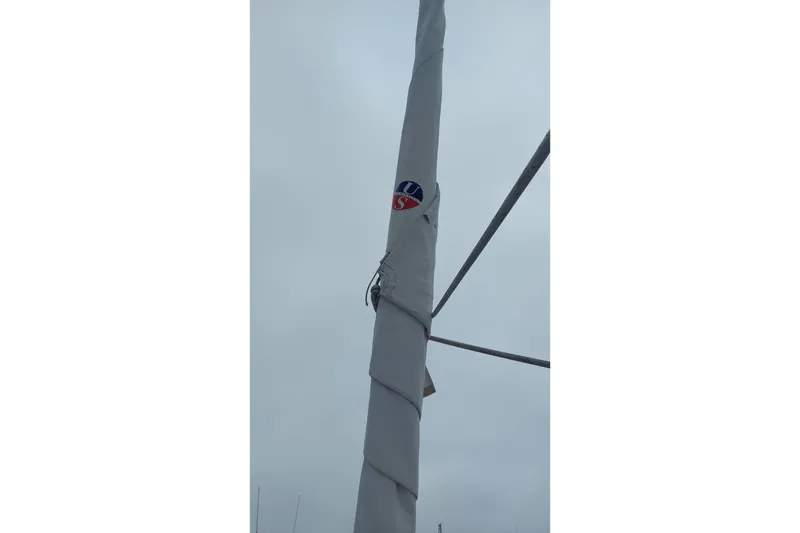 Slide: The Image of Mast of 2002 Jeanneau Sun Odyssey 43 DS sailboat against cloudy sky. - 22