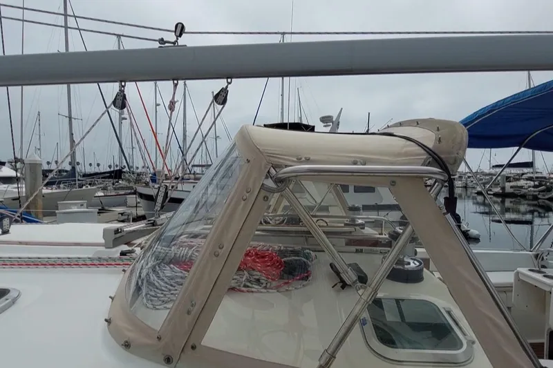 Slide: The Image of 2002 Jeanneau Sun Odyssey 43 DS sailboat docked in marina, featuring cockpit and rigging. - 26