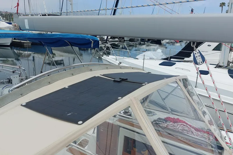 Slide: The Image of Jeanneau Sun Odyssey 43 DS sailboat with solar panel, docked in marina, 2002 model. - 27