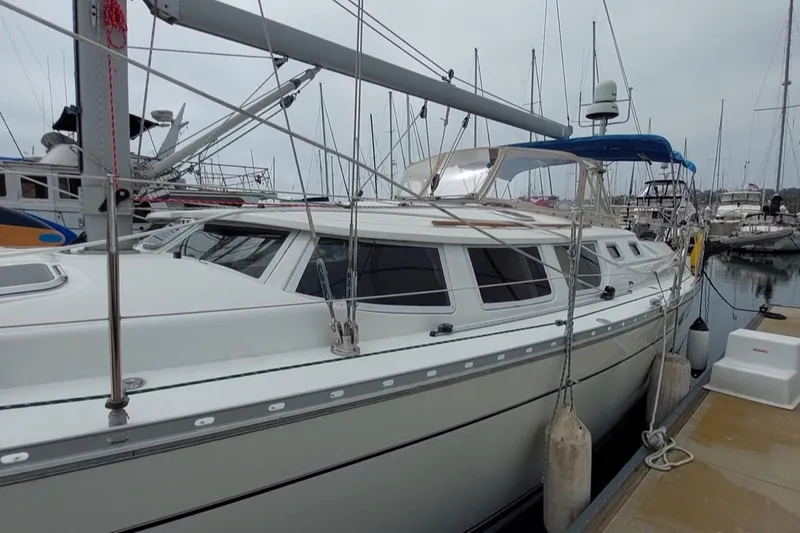 Slide: The Image of 2002 Jeanneau Sun Odyssey 43 DS sailboat docked in marina, side view. - 3
