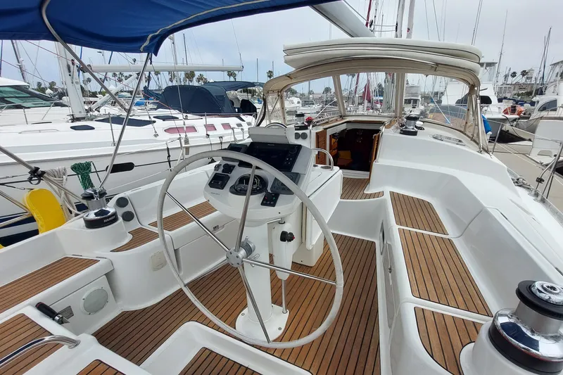 Slide: The Image of Cockpit of 2002 Jeanneau Sun Odyssey 43 DS sailboat with wooden deck and steering wheel. - 30