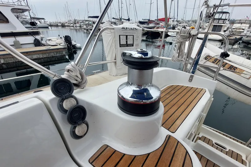 Slide: The Image of Cockpit of 2002 Jeanneau Sun Odyssey 43 DS sailboat in marina setting. - 36