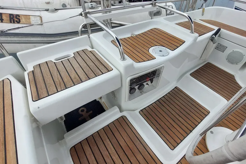 Slide: The Image of Cockpit of 2002 Jeanneau Sun Odyssey 43 DS with teak flooring and control panel. - 38