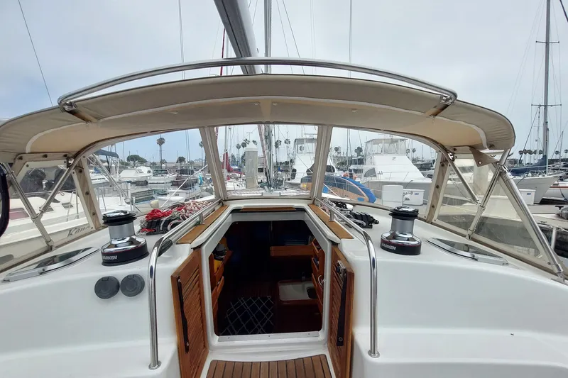 Slide: The Image of 2002 Jeanneau Sun Odyssey 43 DS sailboat cockpit view in marina setting. - 42