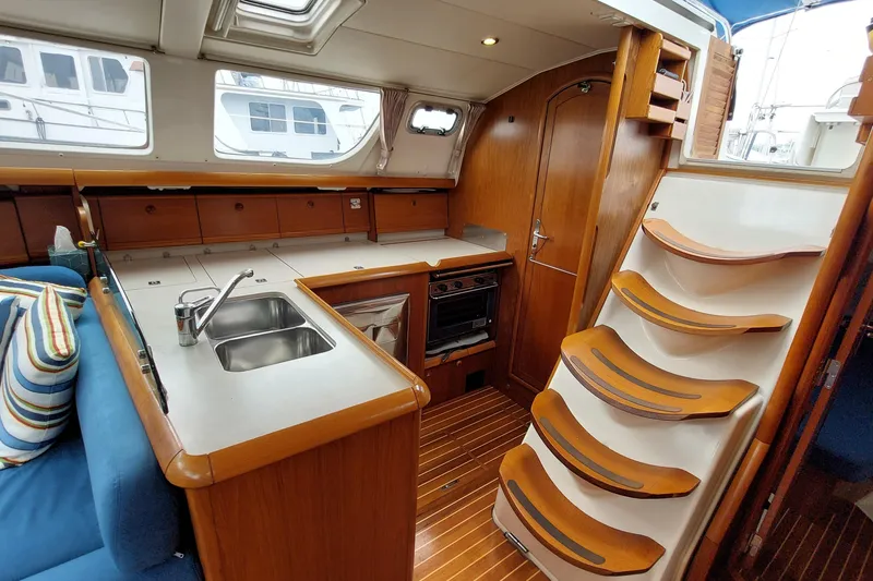 Slide: The Image of Interior of 2002 Jeanneau Sun Odyssey 43 DS yacht with kitchen and stairs. - 49