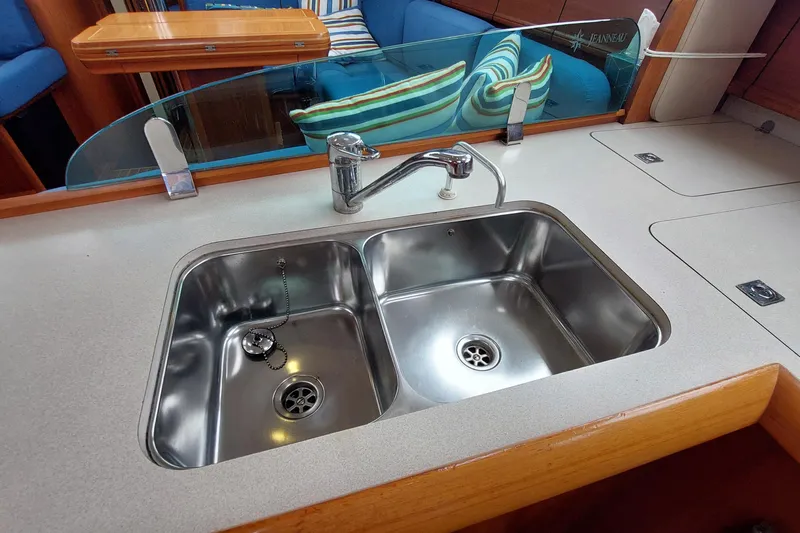 Slide: The Image of Stainless steel sink in 2002 Jeanneau Sun Odyssey 43 DS yacht kitchen. - 55