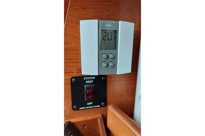 Slide: The Image of Thermostat and diesel heating control panel - 66