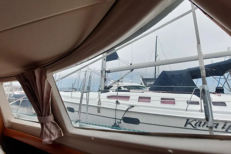 Slide: The Image of View from Jeanneau Sun Odyssey 43 DS (2002) cabin window, overlooking marina with sailboats. - 69