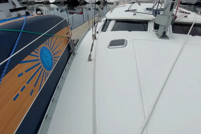 Slide: The Image of 2002 Jeanneau Sun Odyssey 43 DS sailboat deck with logo and rigging. - 7