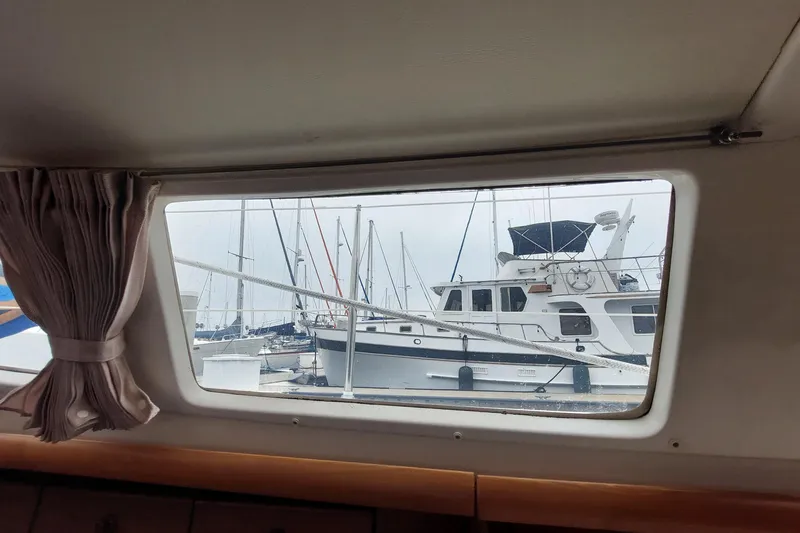 Slide: The Image of View from Jeanneau Sun Odyssey 43 DS (2002) cabin window, overlooking marina with boats. - 71