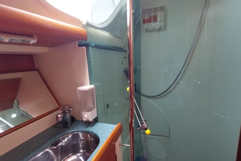 Slide: The Image of Aft head - seperate shower. - 76