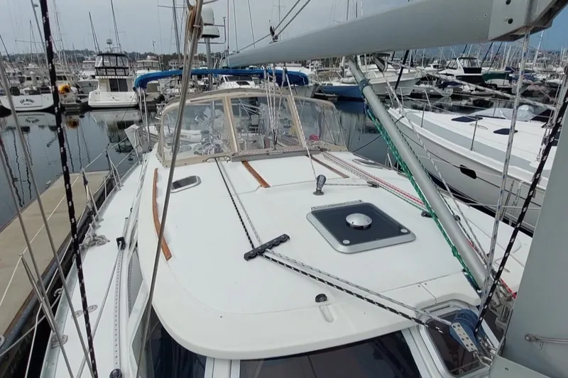 Slide: The Image of 2002 Jeanneau Sun Odyssey 43 DS sailboat docked in a marina. - 8