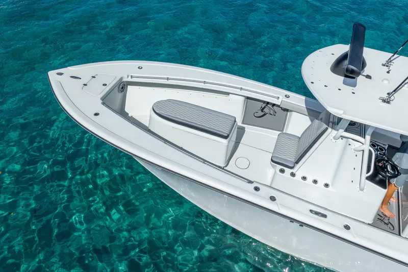 Slide: The Image of 2014 Yellowfin 29 Offshore boat on clear turquoise water. - 19