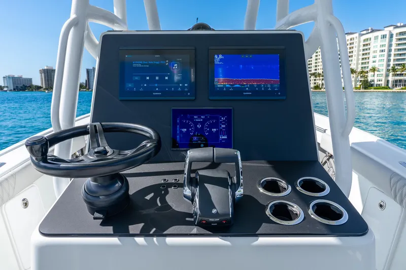Slide: The Image of Control panel of a 2014 Yellowfin 29 Offshore boat with navigation screens. - 21