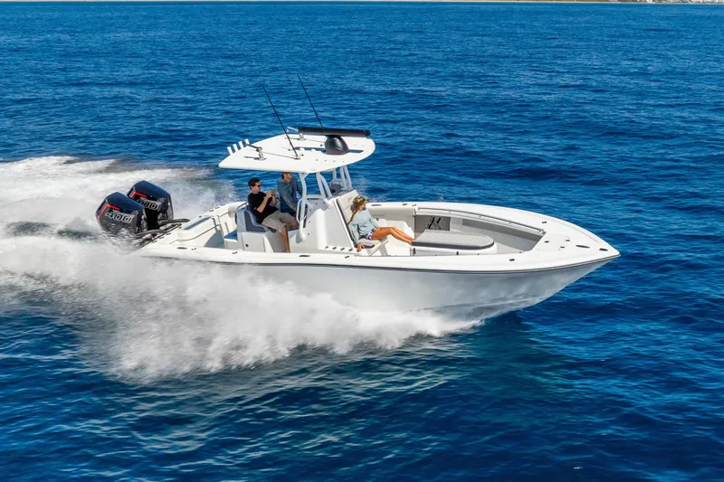 Slide: The Image of 2014 Yellowfin 29 Offshore boat cruising on open blue water. - 3