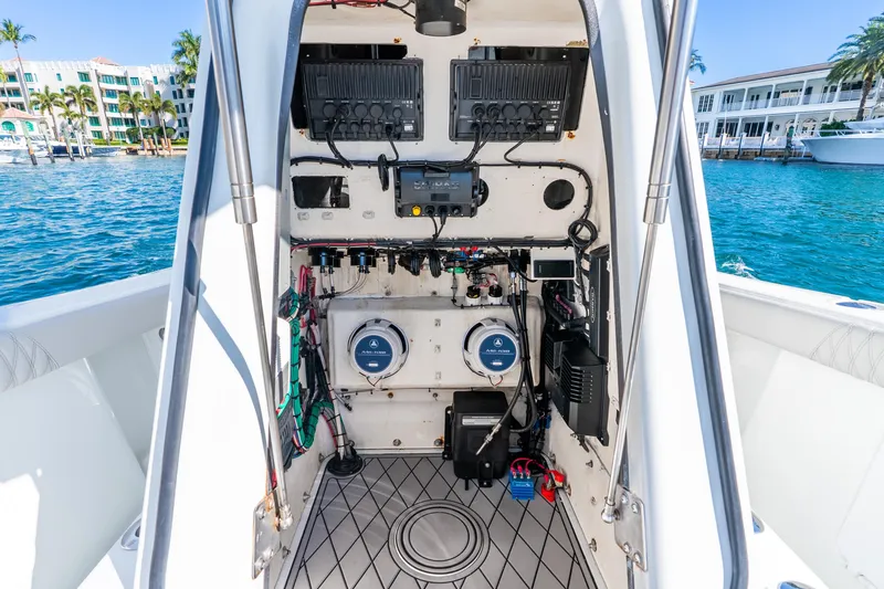 Slide: The Image of 2014 Yellowfin 29 Offshore boat interior with electronic equipment and wiring, dockside view. - 36