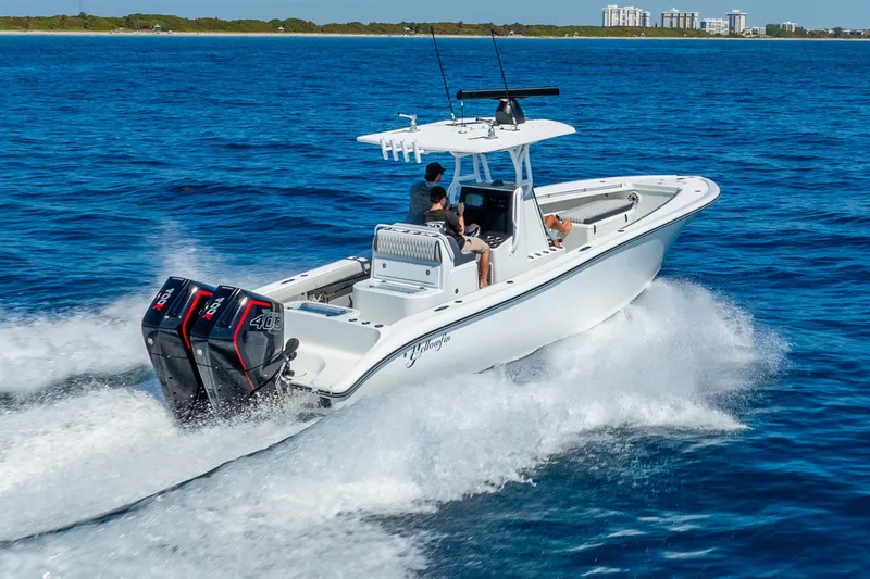 Slide: The Image of 2014 Yellowfin 29 Offshore boat cruising on open blue water. - 6