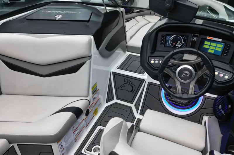 Slide: The Image of 2017 Centurion Ri237 boat interior with modern dashboard and seating. - 11