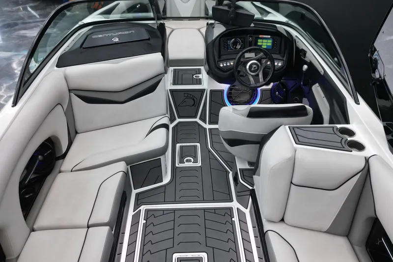 Slide: The Image of 2017 Centurion Ri237 boat interior with modern dashboard, plush seating, and sleek design. - 14