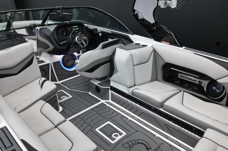 Slide: The Image of Interior of a 2017 Centurion Ri237 boat with modern seating and dashboard. - 15