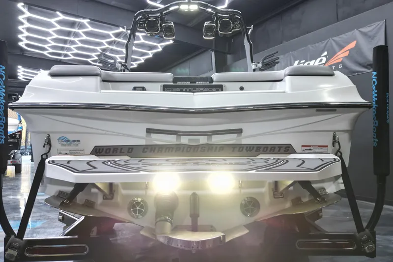 Slide: The Image of 2017 Centurion Ri237 boat in showroom with illuminated platform and sleek design. - 20
