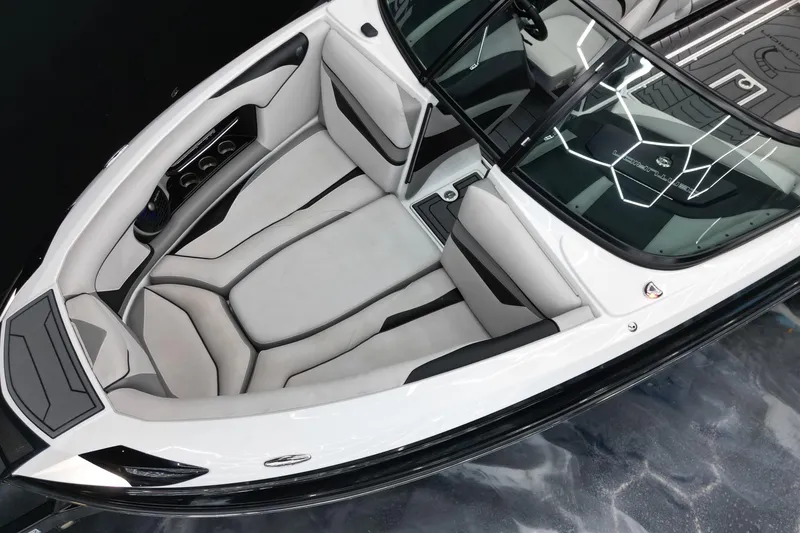 Slide: The Image of 2017 Centurion Ri237 boat interior with sleek white and black seating design. - 7