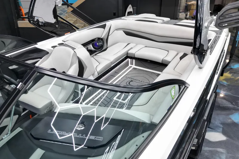 Slide: The Image of 2017 Centurion Ri237 boat interior with sleek white seating and modern design. - 9