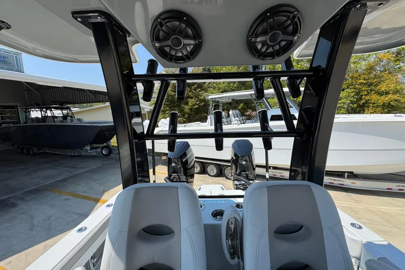 Slide: The Image of 2026 Caymas 29 CT boat interior with seating and mounted speakers. - 31