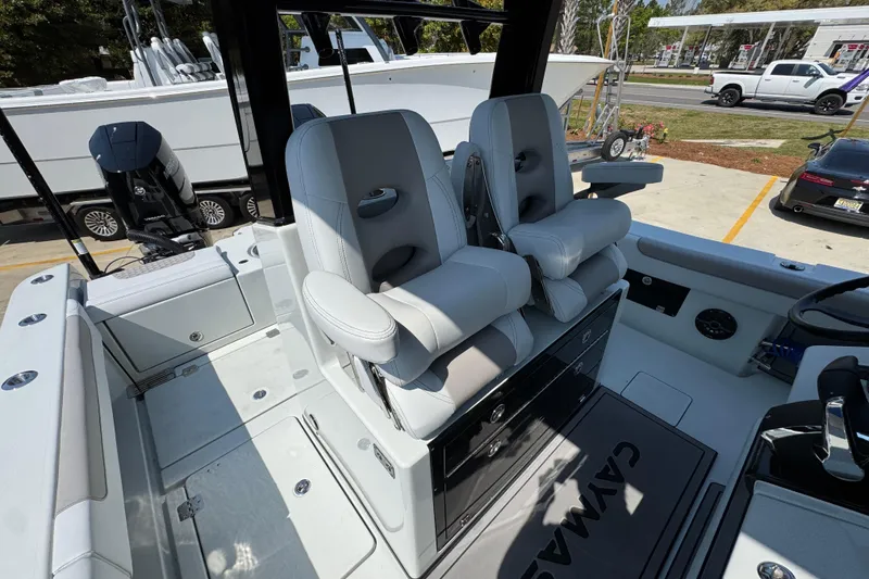 Slide: The Image of 2026 Caymas 29 CT boat interior with dual captain's chairs and sleek design. - 32