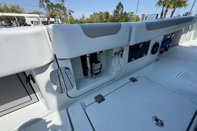 Slide: The Image of 2026 Caymas 29 CT boat interior with storage compartments and seating. - 38