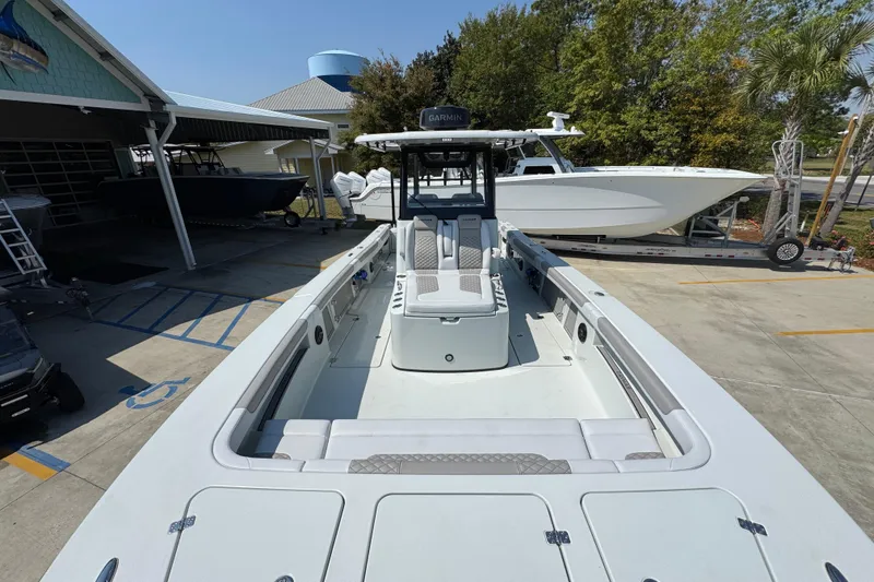 Slide: The Image of 2026 Caymas 29 CT boat in a marina, showcasing spacious deck and modern design. - 20