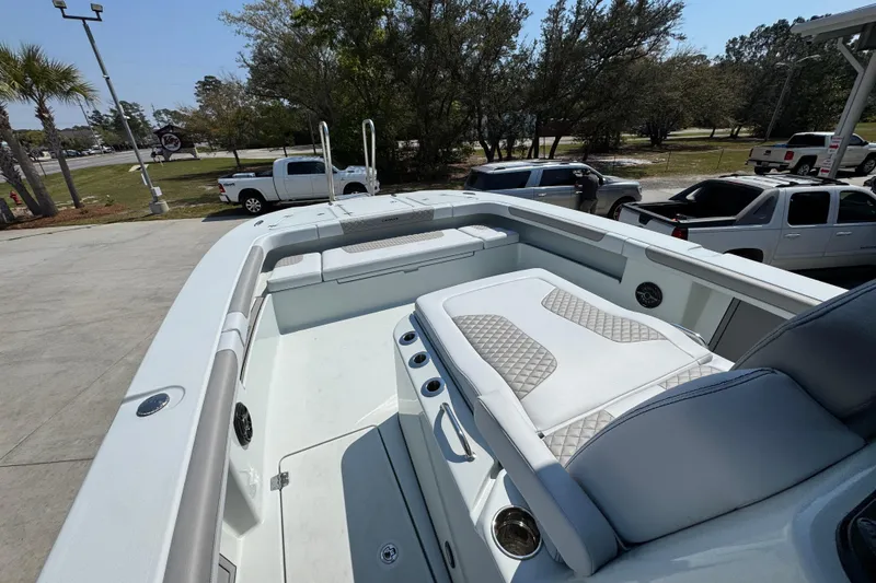 Slide: The Image of 2026 Caymas 29 CT boat interior with cushioned seating and modern design. - 22