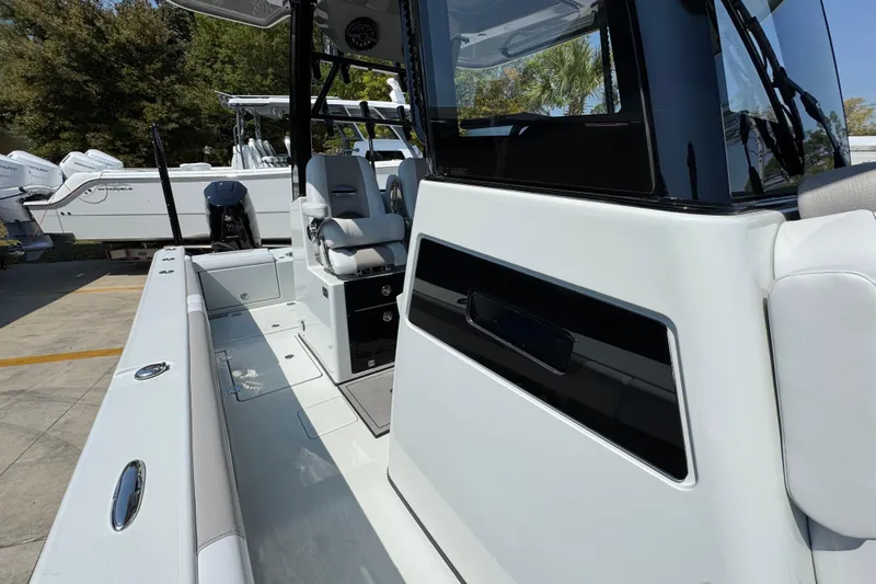 Slide: The Image of 2026 Caymas 29 CT boat interior with sleek seating and modern design. - 26