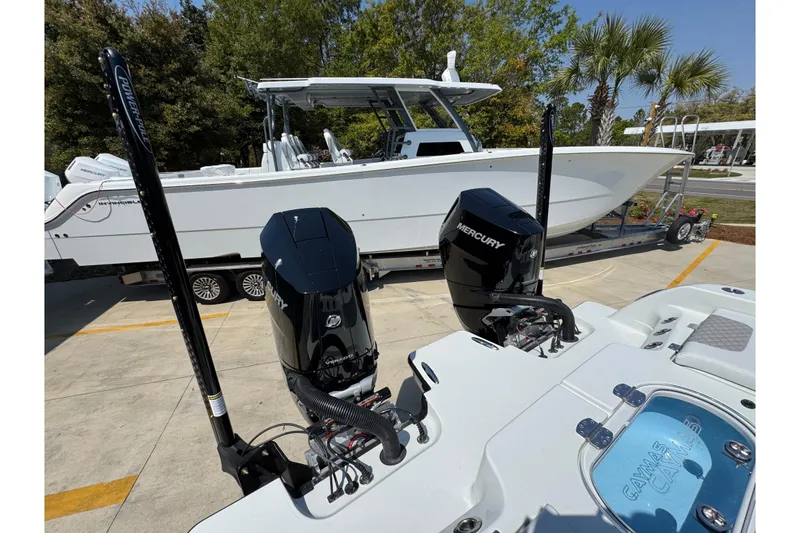 Slide: The Image of 2026 Caymas 29 CT boat with dual Mercury engines on a trailer. - 45