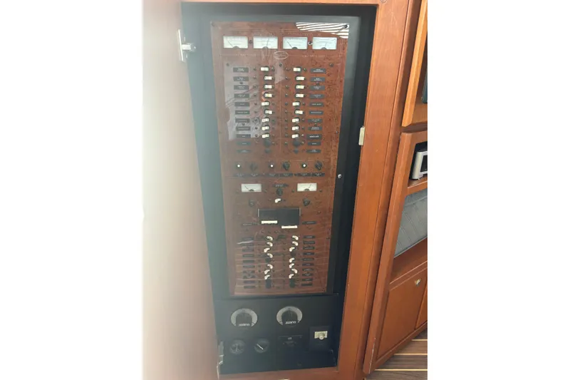 Slide: The Image of Electrical panel of a 2005 Silverton 38 Convertible yacht, featuring switches and gauges. - 16