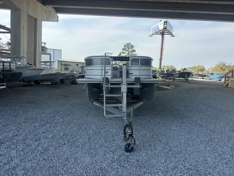 Slide: The Image of 2018 South Bay 200 Series Tritoon parked under bridge. - 3