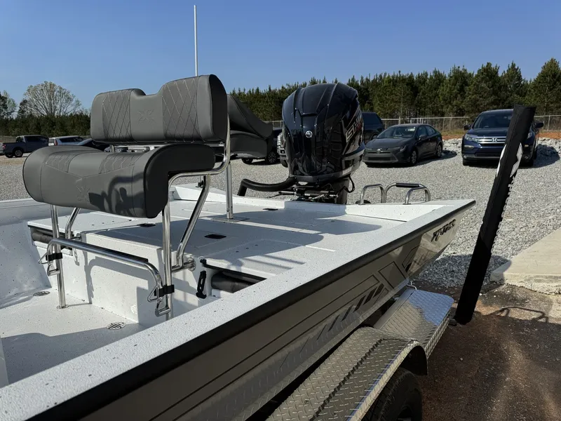 Slide: The Image of 2026 Xpress Hyper-Lift Series H22B-200HP boat on trailer. - 9