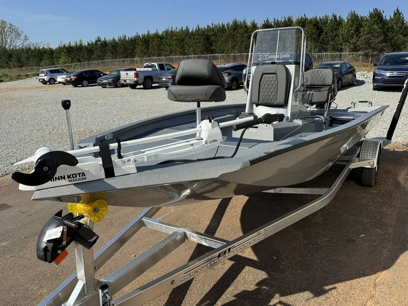 Slide: The Image of 2026 Xpress H20B Bay boat parked on trailer outdoors. - 3