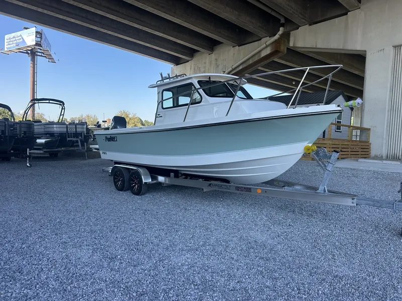 Slide: The Image of Parker 227 Explorer boat 2026 on trailer under bridge. - 2
