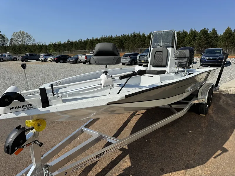 Slide: The Image of 2026 Xpress Hyper-Lift Series H22B-200HP boat on trailer. - 3