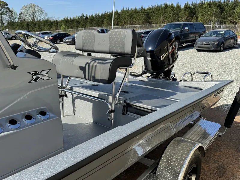 Slide: The Image of 2026 Xpress H20B Bay boat with outboard motor. - 9