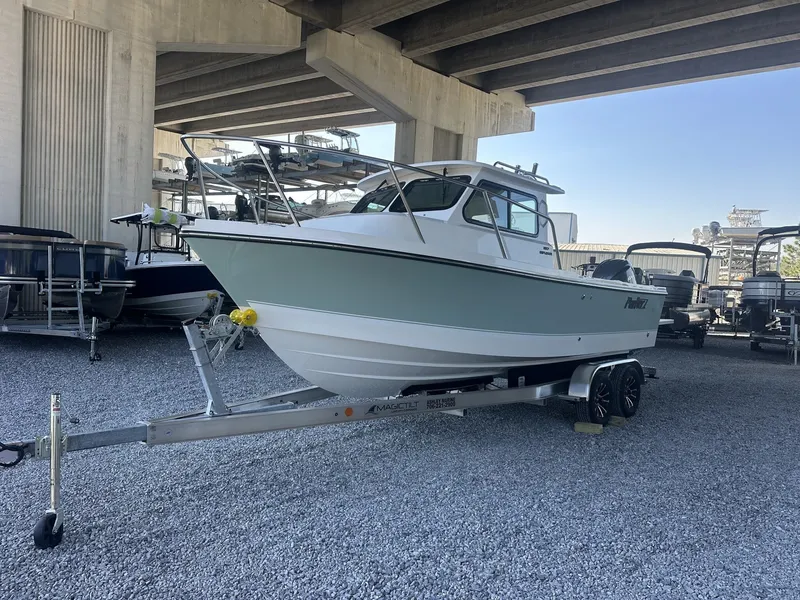 Slide: The Image of 2026 Parker 227 Explorer boat on trailer under bridge. - 7