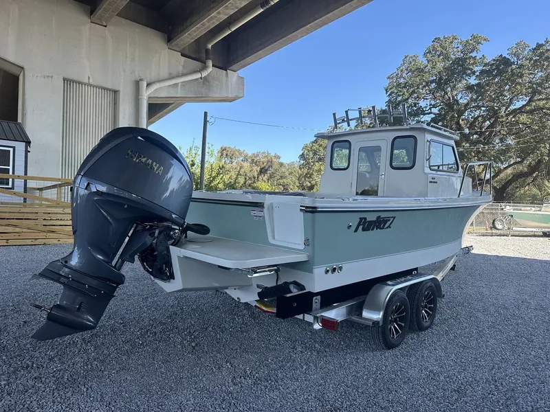 Slide: The Image of Parker 227 Explorer boat 2026 with outboard motor under bridge. - 3