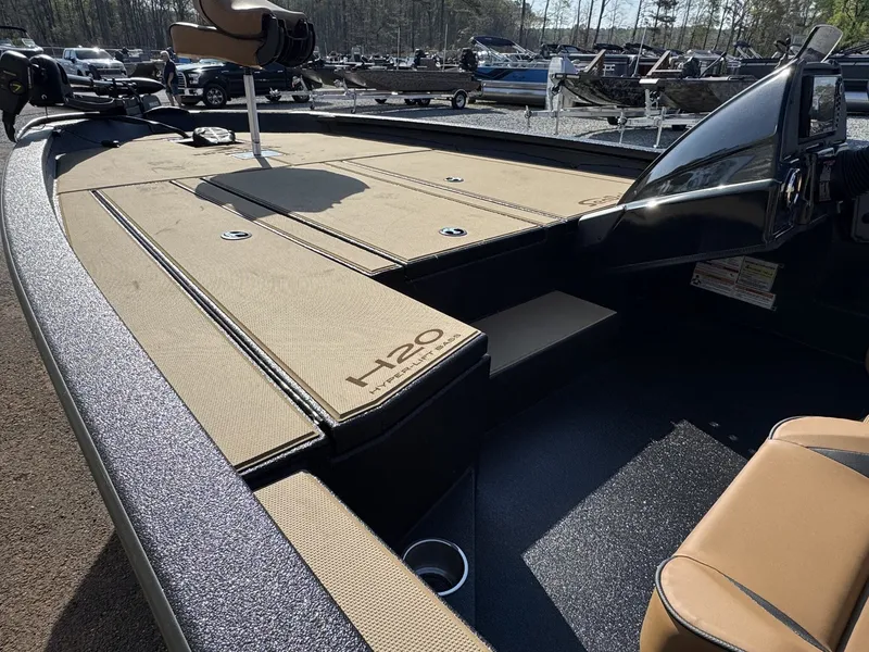 Slide: The Image of 2026 Xpress Hyper-Lift Bass H20 boat, interior view, beige upholstery. - 5