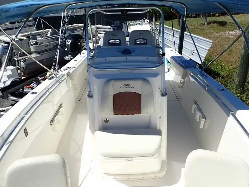 Slide: The Image of 2020 Cobia 280 Center Console boat with blue canopy. - 15