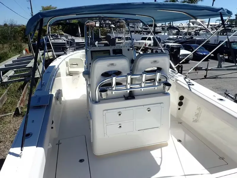 Slide: The Image of 2020 Cobia 280 Center Console boat with blue canopy. - 6