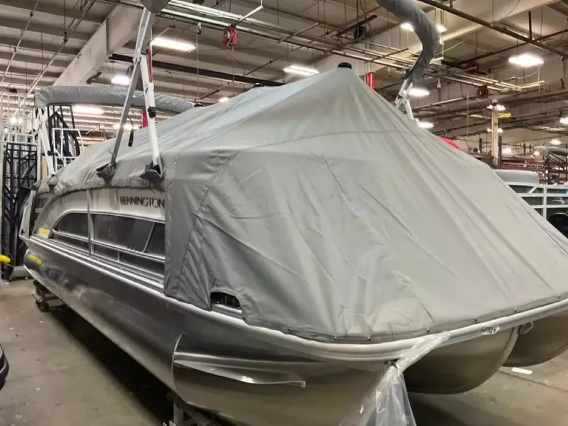 Slide: The Image of Bennington 24 MFB 2026 pontoon boat with cover in warehouse. - 10