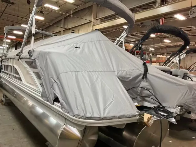 Slide: The Image of Bennington 24 MFB 2026 pontoon boat covered in warehouse. - 9