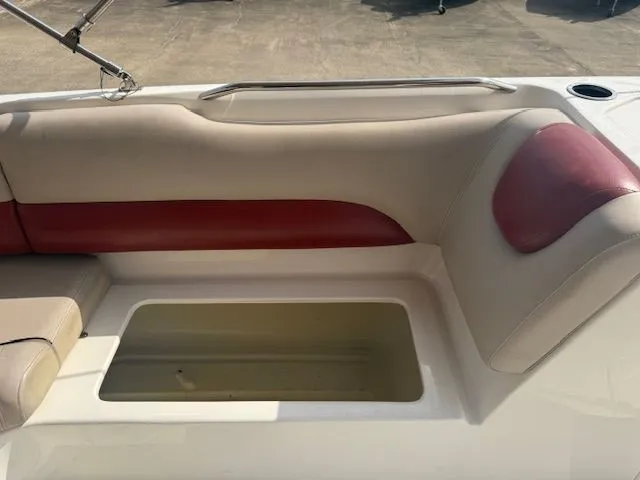 Slide: The Image of Interior of a 2014 Hurricane SSR188 boat with red and beige seating. - 14